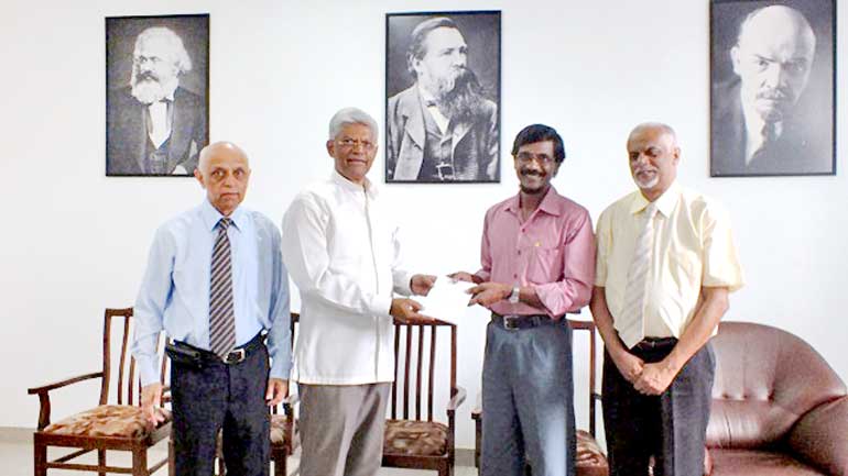 Pathfinder Foundation Chairman Bernard Goonetilleke handing over the document to JVP General Secretary Tilvin Silva 2